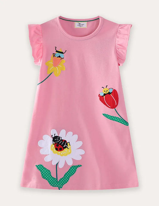Abito con applicazioni di fiori e insetti