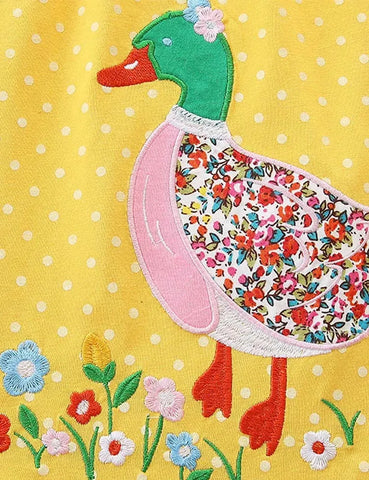 Vestido de lunares con aplicación de pato floral